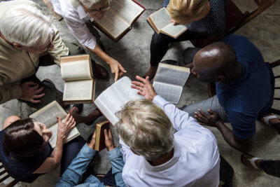 group christians reading bible together